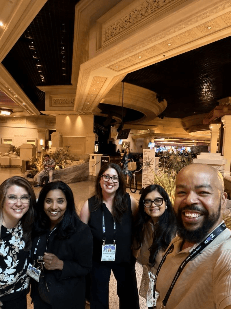 Members of the Lily AI team together at an industry event.