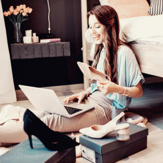 A woman shopping online on her laptop.