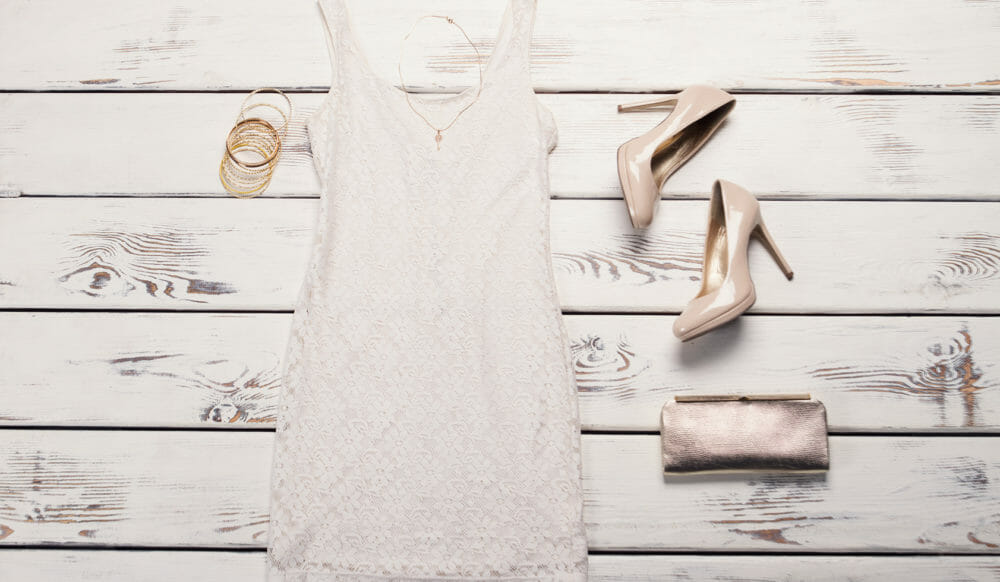 A lace dress, purse, and heels