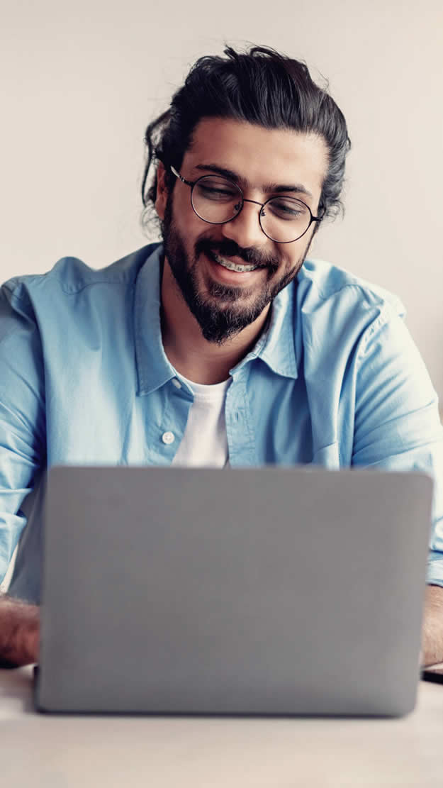 Man working on computer with his business partners.