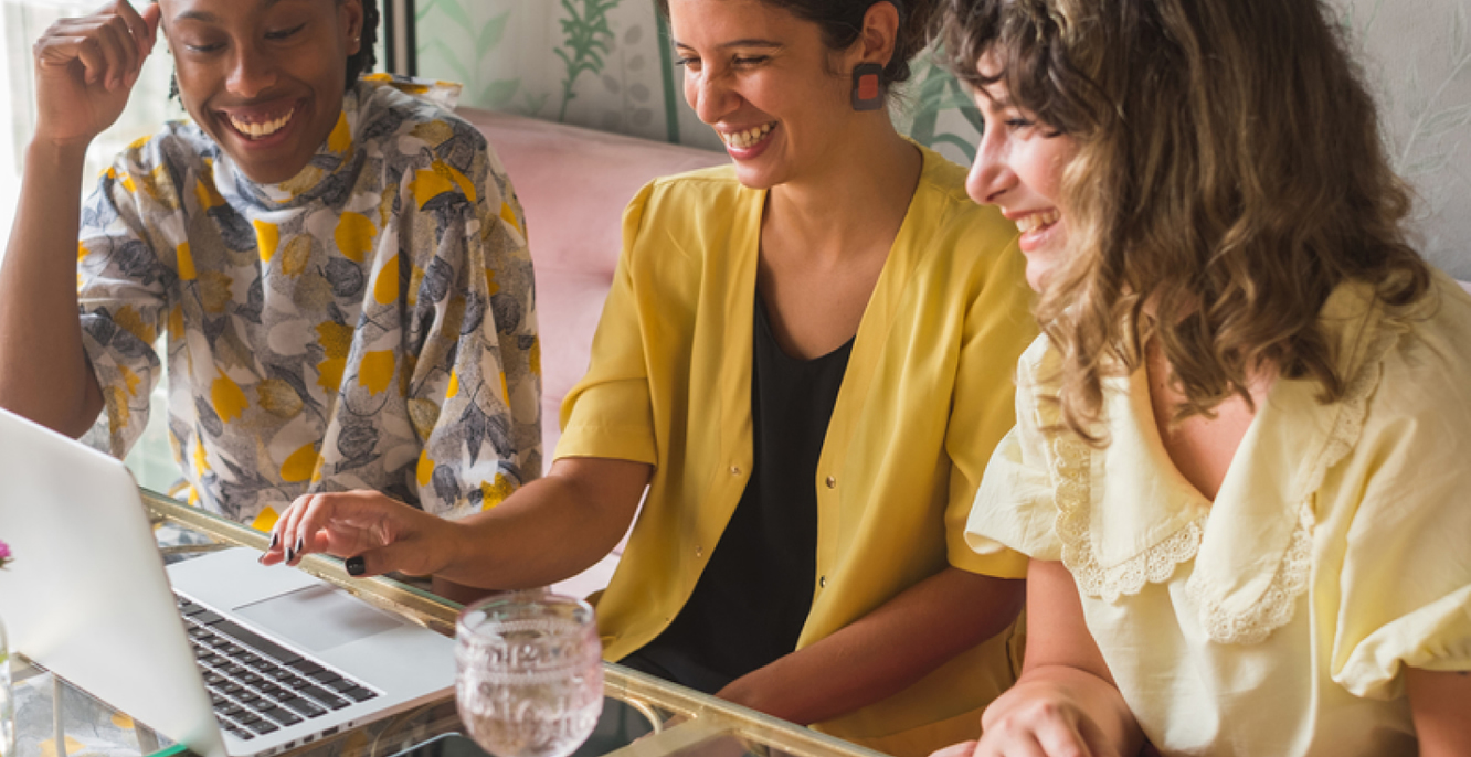 Group of smiling women online shopping together - Product Attribution.