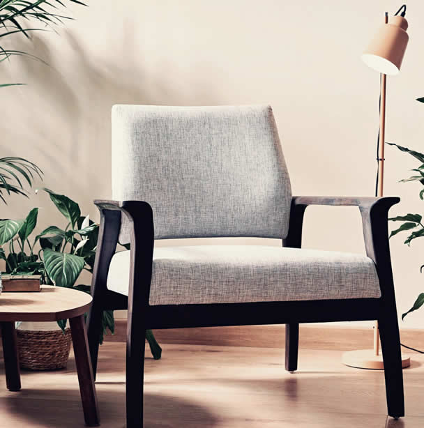 Mid-century modern accent chair attributed in a neutral colored home.