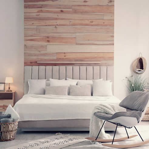 Image of a neutral warm bedroom with wooden furniture and soft textural linens.