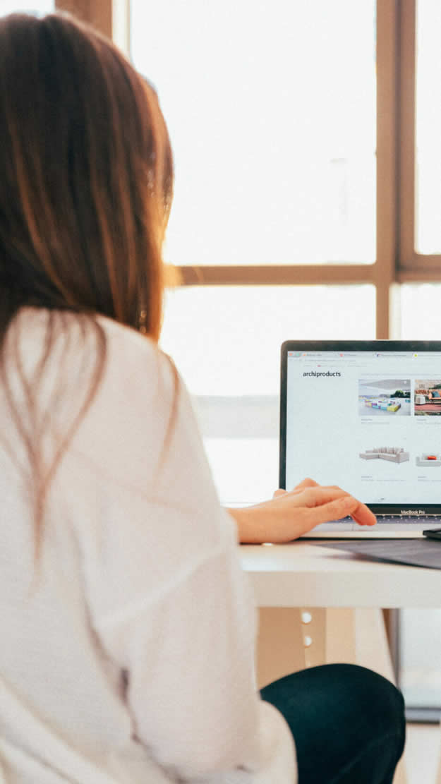 Woman searching for products on a retailer's website on her laptop.